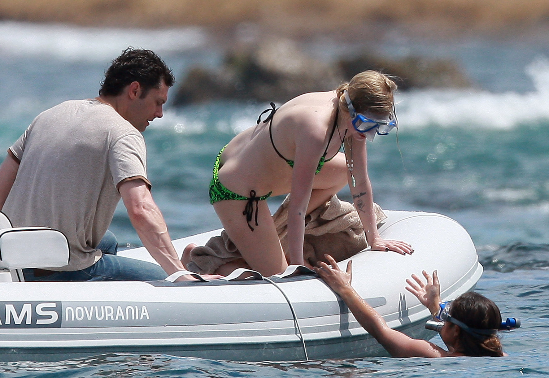 Avril Lavigne in a green bikini in Cabo, Mexico on July 27, 2012