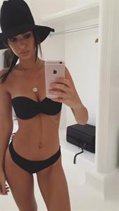 Emily Ratajkowski in a bikini taking a selfie