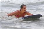 Daniela Hantuchova bikini beach surfing candids in Brisbane, Australia, December 26, 2012 