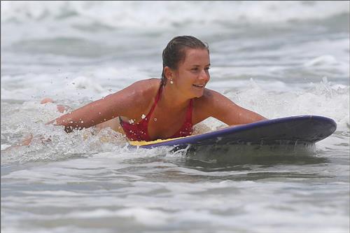 Daniela Hantuchova bikini beach surfing candids in Brisbane, Australia, December 26, 2012 
