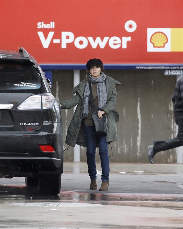 Dannii Minogue - Pictured getting a little wet while filling up on petrol - 09th August 2012