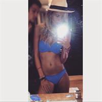 Frankie Gaff in a bikini taking a selfie