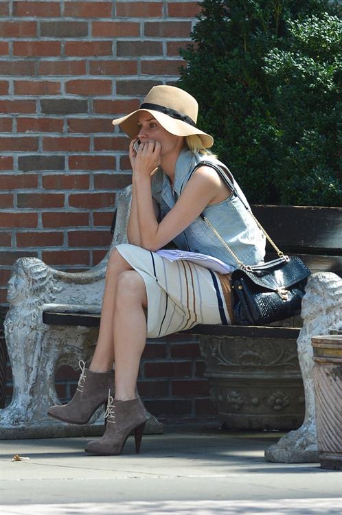 Diane Kruger - Wears a denim vest with a skirt as she chats on her cellphone while out the Bowery on September 12, 2012