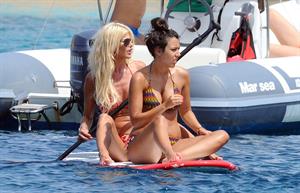 Victoria Silvstedt wearing a bikini on a board in Sardinia on August 8, 2012