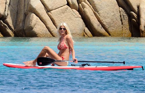 Victoria Silvstedt wearing a bikini on a board in Sardinia on August 8, 2012
