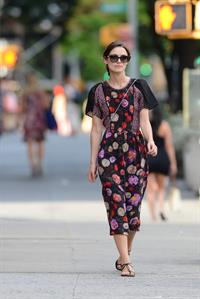 Keira Knightley wears a dark floral dress while strolling in New York City on August 7, 2012