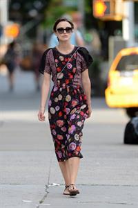 Keira Knightley wears a dark floral dress while strolling in New York City on August 7, 2012