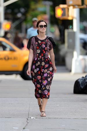 Keira Knightley wears a dark floral dress while strolling in New York City on August 7, 2012