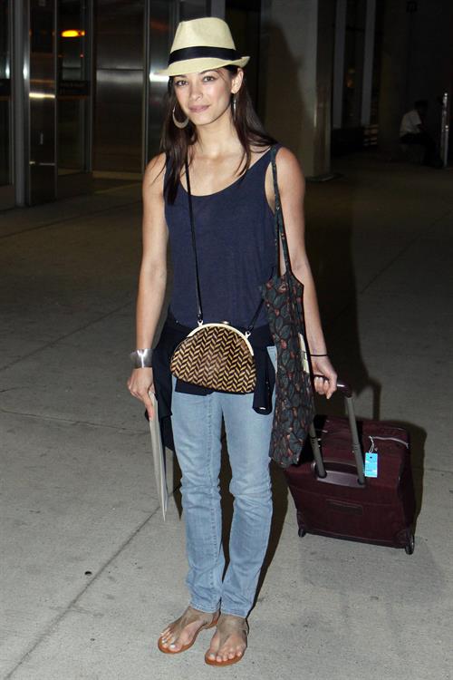 Kristin Kreuk - Pearson International Airport arrival candids in Toronto (July 16, 2012)