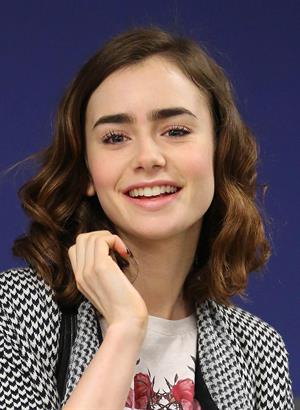 Lily Collins - LAX Airport 8/27/13