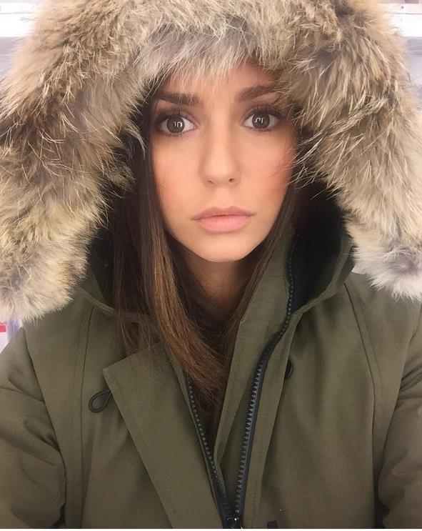 Nina Dobrev taking a selfie