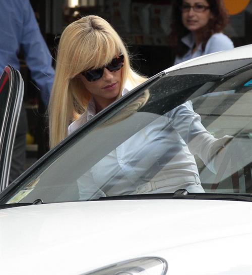 Michelle Hunziker Leaving her house in a white dress in Milan Italy on May 9, 2013