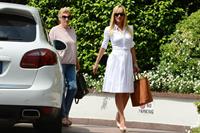 Michelle Hunziker Leaving her house in a white dress in Milan Italy on May 9, 2013