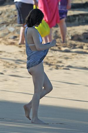 Milla Jovovich on the beach in a bikini on New Years Eve in Maui, Hawaii December 31, 2012 