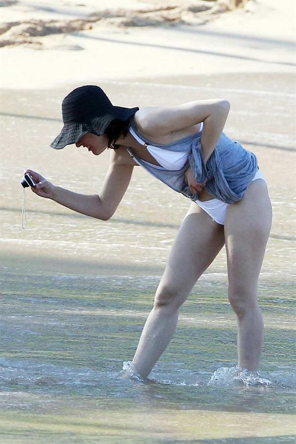 Milla Jovovich on the beach in a bikini on New Years Eve in Maui, Hawaii December 31, 2012 