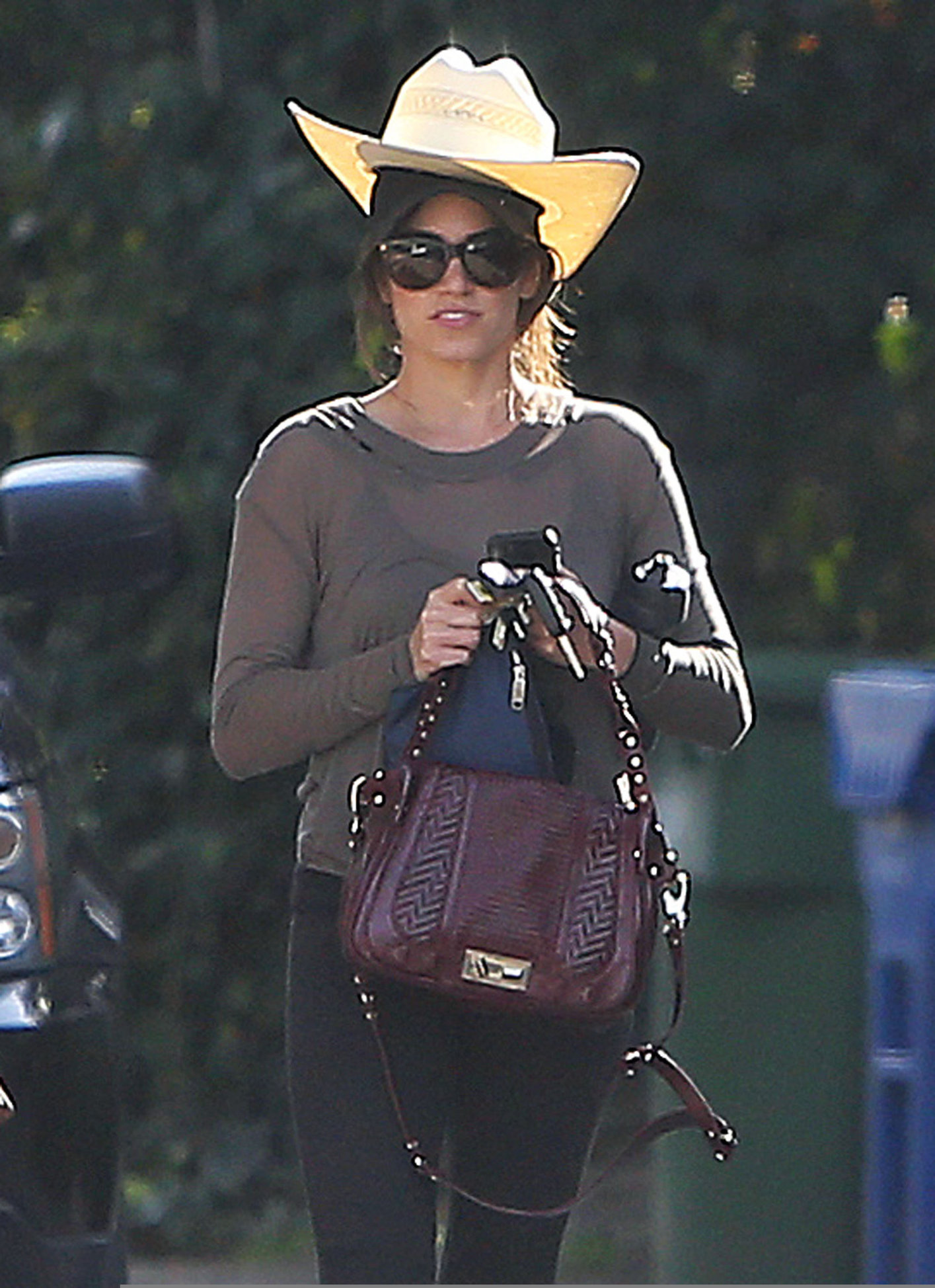 Nikki Reed walking and wearing her cowboy hat in Los Angeles on February 21, 2013