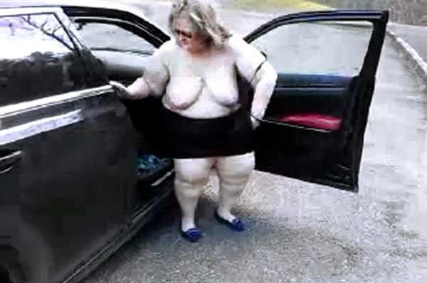 Wearing a miniskirt and showing my big 48DD tits outdoors in public