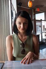 Tracy Maura in a green sexy dress