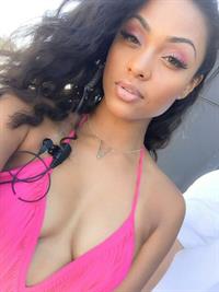 Brittney Elena in a bikini taking a selfie