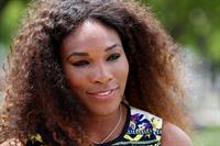 Serena Williams poses for a Photograph at the Wheel of Brisbane in South Bank December 31, 2012 
