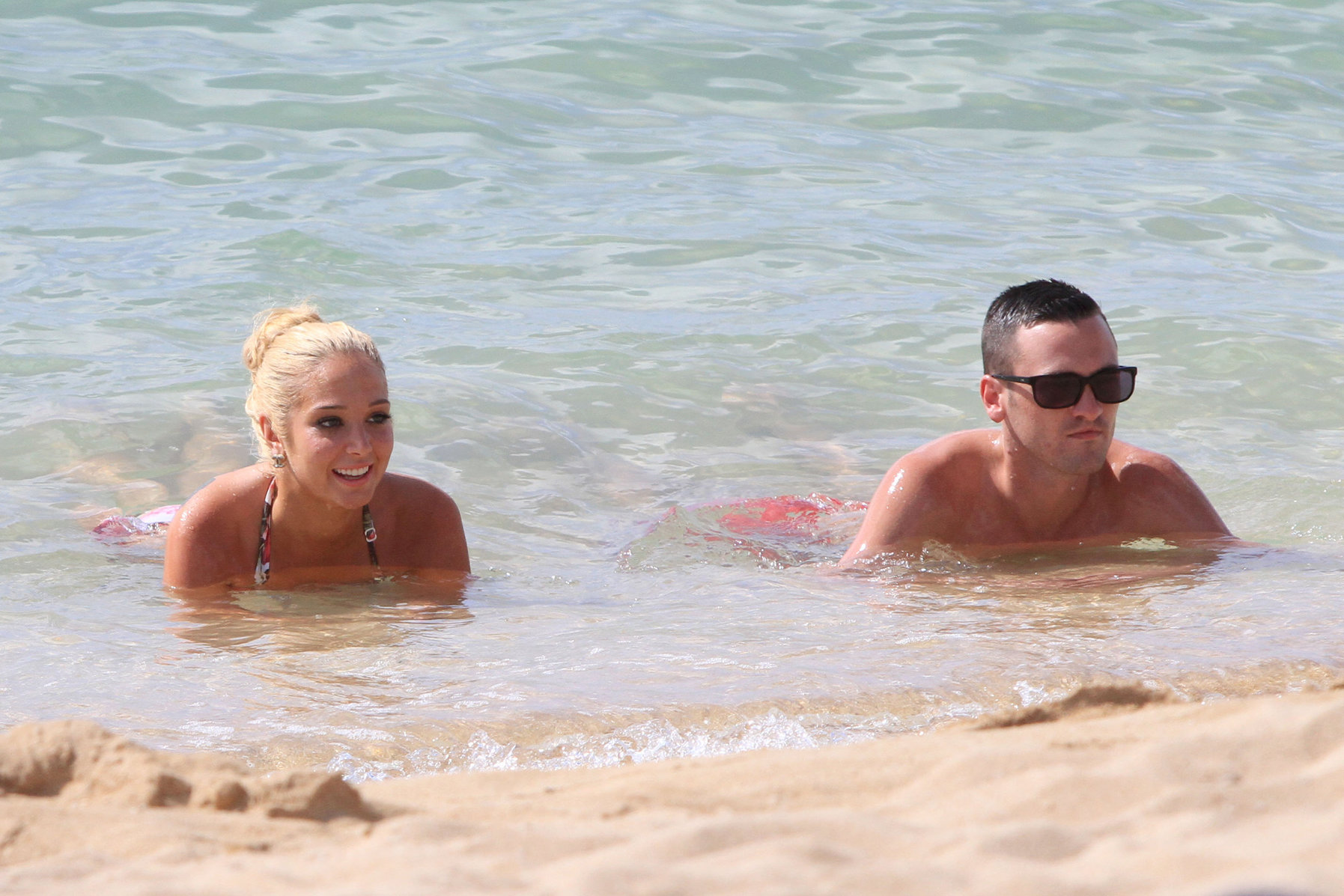 Tulisa Contostavlos Bikini Pictures Tulisa Contostavlos in a bikini on the beach in Honolulu July 31, 2012