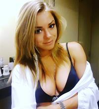 Nikki Leigh in a bikini taking a selfie