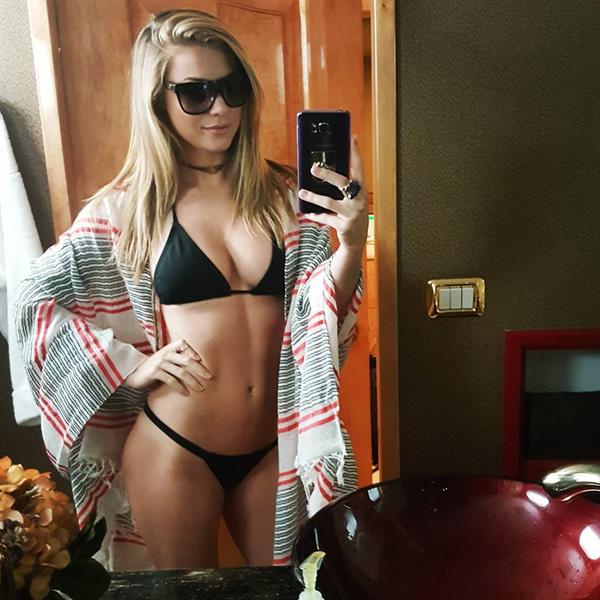 Nikki Leigh in a bikini taking a selfie