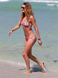 Doutzen Kroes enjoys a day on the beach in Miami Beach, FL on April 28, 2013