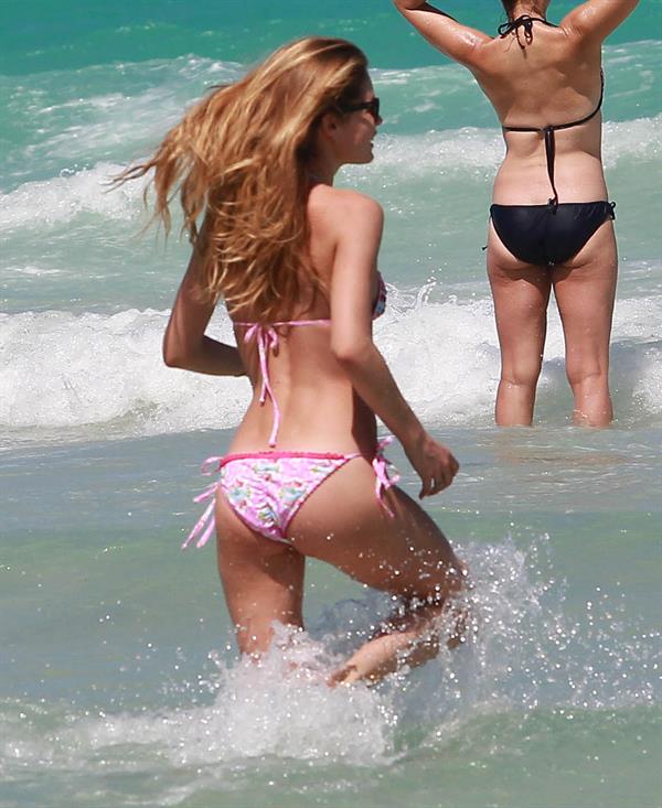 Doutzen Kroes enjoys a day on the beach in Miami Beach, FL on April 28, 2013