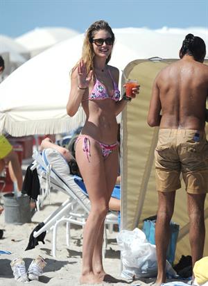 Doutzen Kroes enjoys a day on the beach in Miami Beach, FL on April 28, 2013