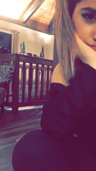 Becky G taking a selfie