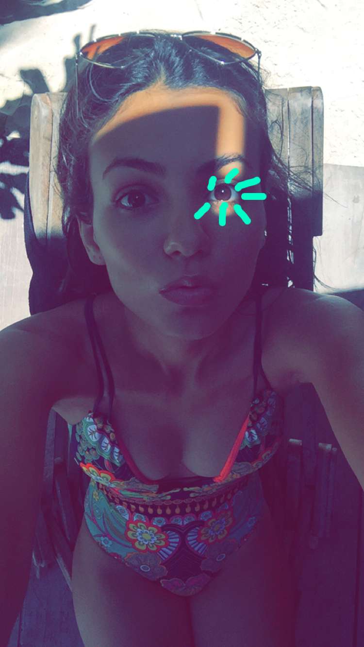 Victoria Justice in a bikini taking a selfie