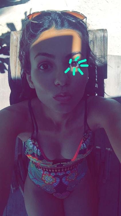 Victoria Justice in a bikini taking a selfie