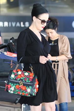 Dita Von Teese arrives from a flight at LAX August 20, 2014