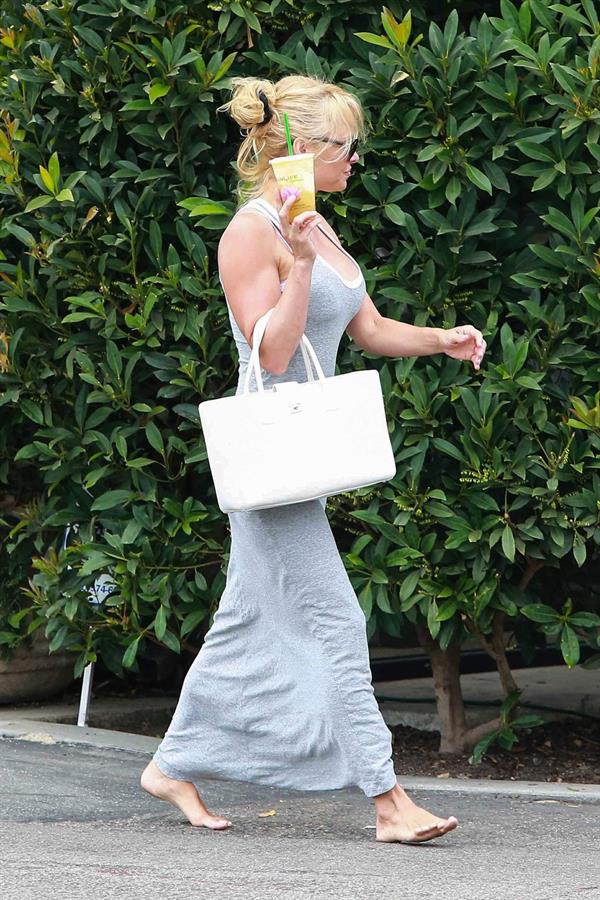 Pamela Anderson leaves barefoot a local Restaurant with a friend in Malibu July 6, 2013 