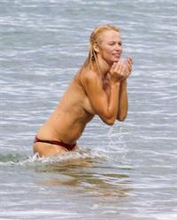 Pamela Anderson Pamela Anderson Going topless at the beach in France 02.10.13