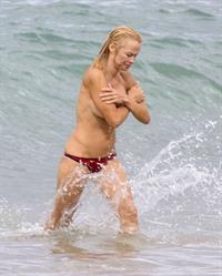 Pamela Anderson Pamela Anderson Going topless at the beach in France 02.10.13