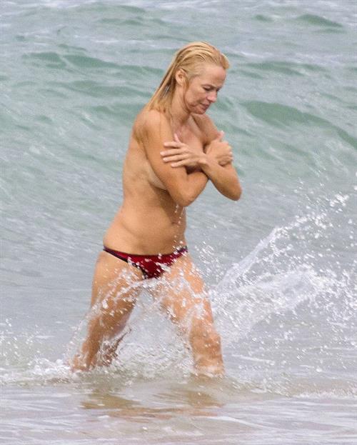 Pamela Anderson Pamela Anderson Going topless at the beach in France 02.10.13