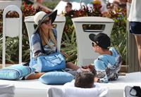 Paris Hilton spends the day in and out of the pool in Miami December 8, 2012