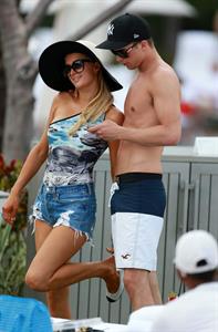 Paris Hilton spends the day in and out of the pool in Miami December 8, 2012