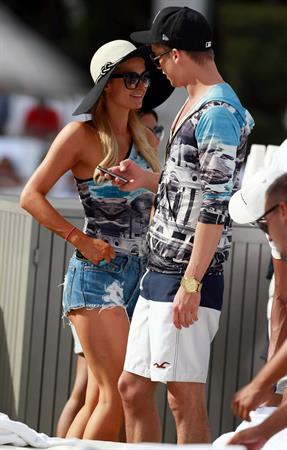 Paris Hilton spends the day in and out of the pool in Miami December 8, 2012