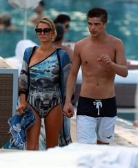 Paris Hilton spends the day in and out of the pool in Miami December 8, 2012