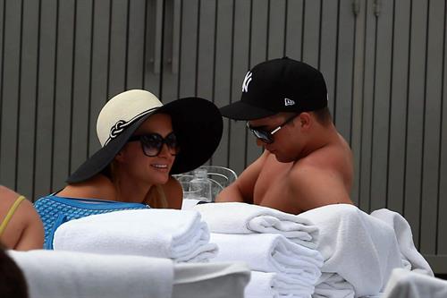 Paris Hilton spends the day in and out of the pool in Miami December 8, 2012