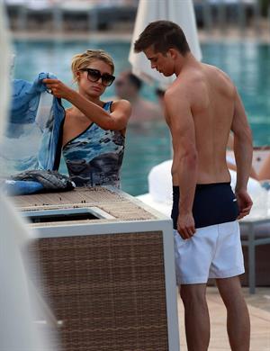 Paris Hilton spends the day in and out of the pool in Miami December 8, 2012