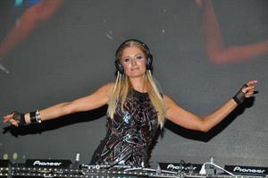 Paris Hilton walks for designer duo Shane and Falguni Peacock and performs as a DJ at the India Resort Fashion Week