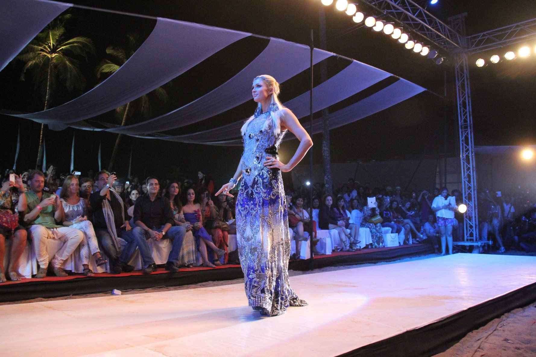 Paris Hilton Pictures Paris Hilton walks for designer duo Shane and Falguni Peacock and performs as a DJ at the India Resort Fashion Week