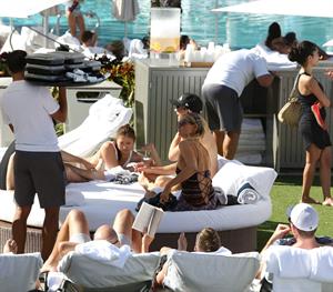 Paris Hilton poolside at their Miami hotel December 7-2012 