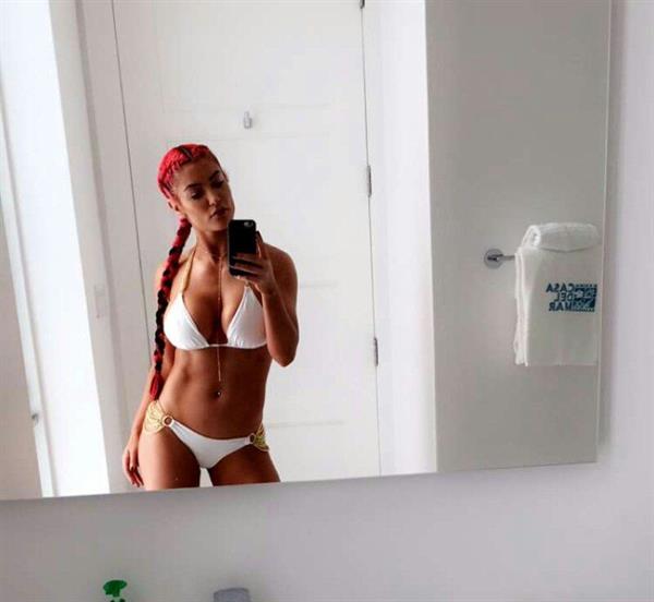 Natalie Eva Marie in a bikini taking a selfie