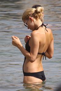 Paris Hilton - Wearing a swimsuit at a beach in France August 6, 2012