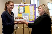 Agnieszka Radwanska is presented a cake for her birthday during the BNP Paribas Open March 6, 2013 